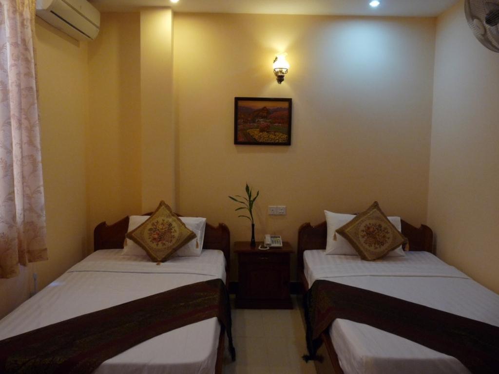 Hi Land Hotel Phnom Penh Habitación foto